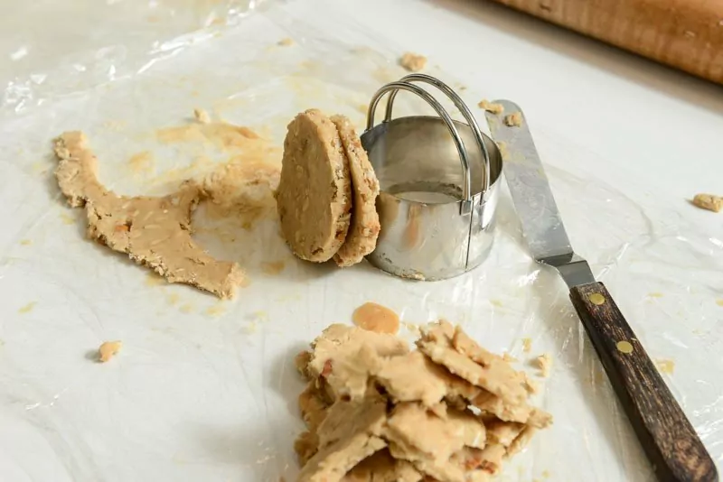 Cutting and rolling the cookie dough.