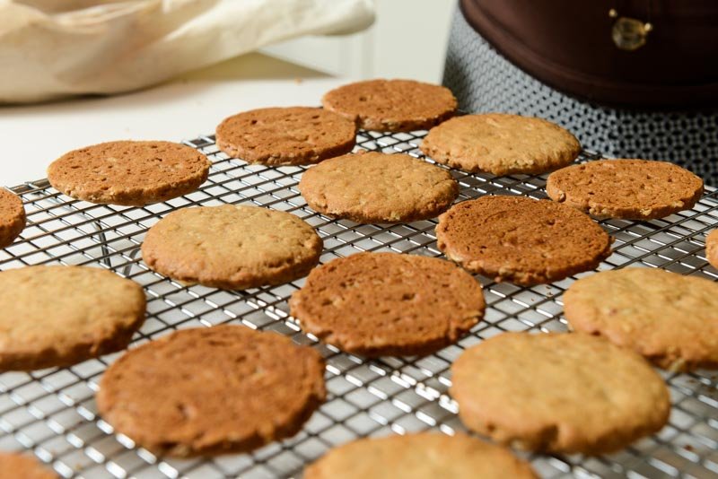 Turning half the cookies over before filling.