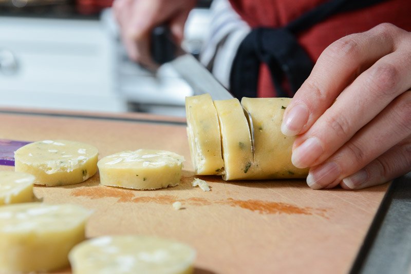 Slicing the cold cookie dough.