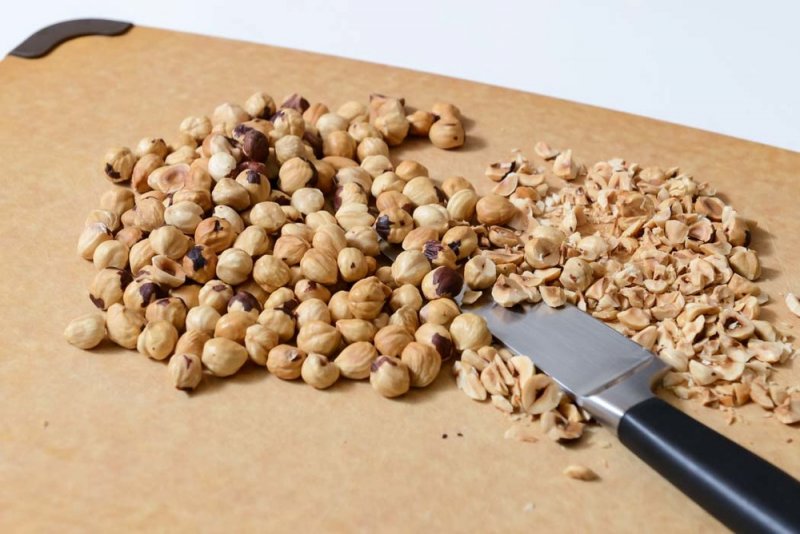 Chopping toasted hazelnuts.