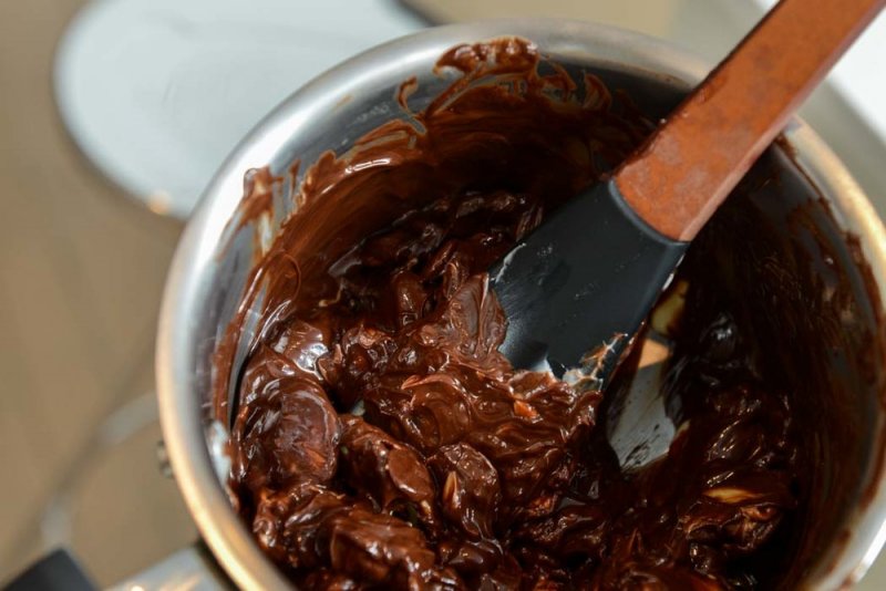 Melting dark and white chocolate with butter for the brownies.