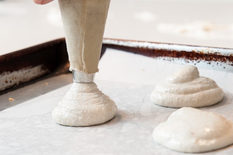 Piping the macaron batter.