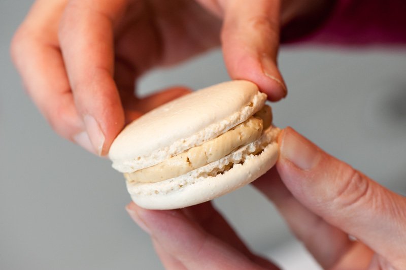 Making the macaron sandwich.