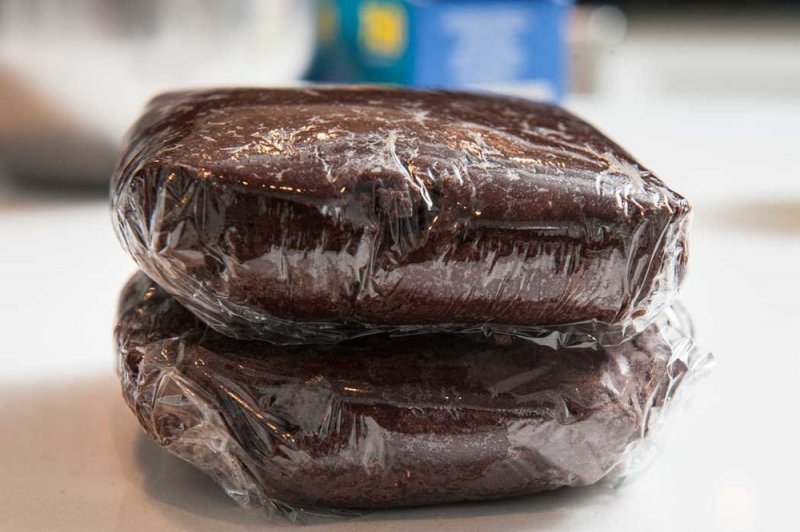 The chocolate shortbread cookie dough wrapped in plastic.