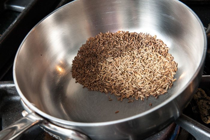 Toasting cumin and caraway.