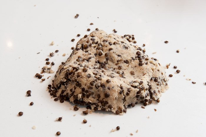 Kneading the roasted lentils into the cookie dough.