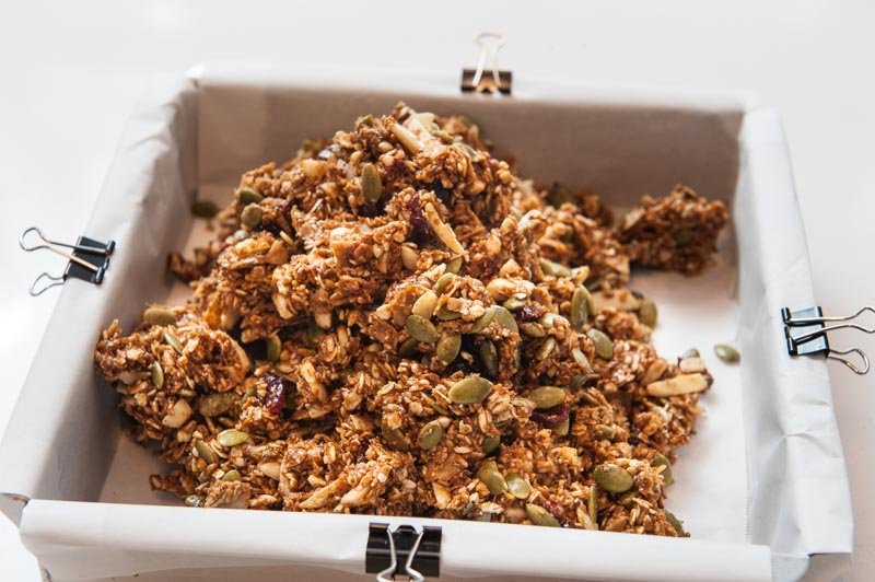 The Granola bar mix in the prepared pan.