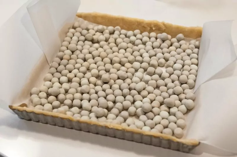 Blind baking with the pie weights (so much easier than beans or rice)