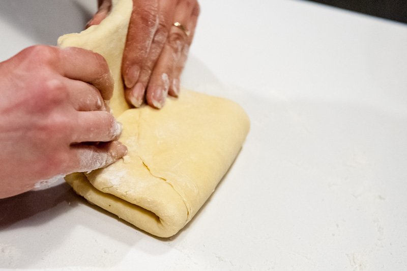 Making the biz fold in the brioche dough.