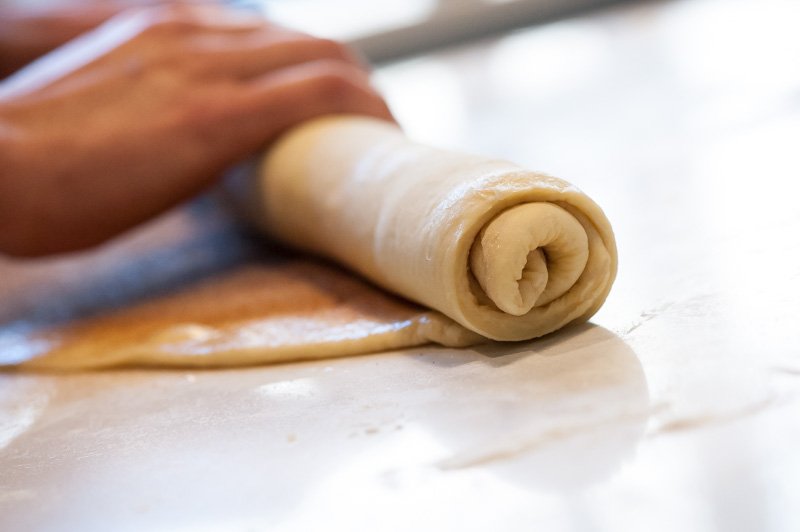 The brioche being rolled.