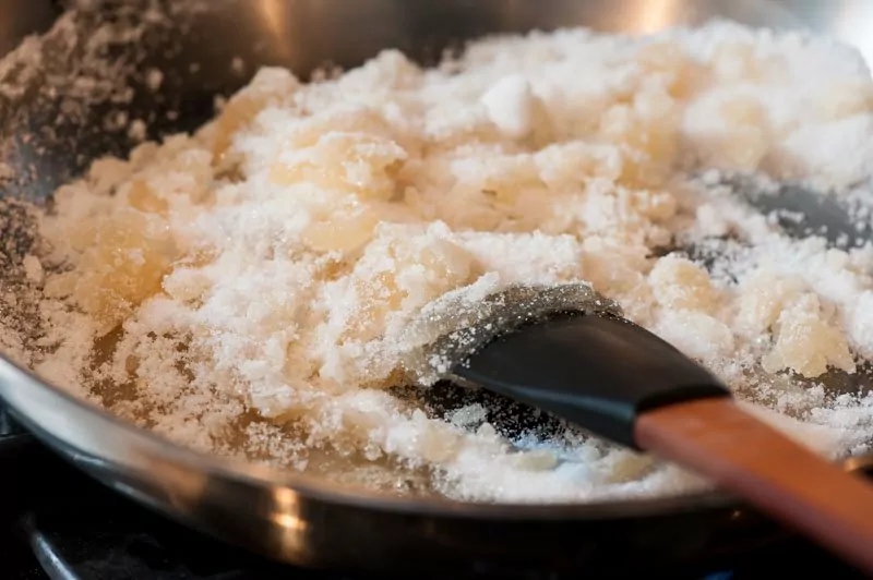 Mixing the white sugar and honey.