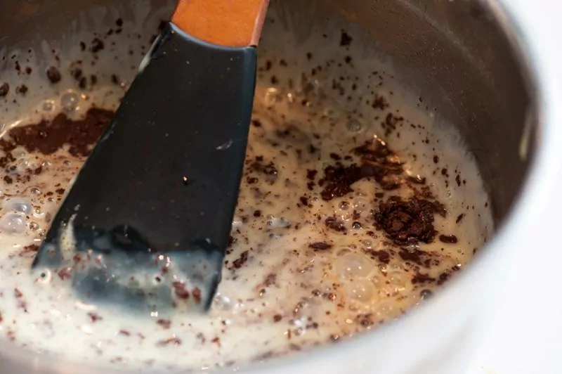 The chocolate beginning to melt into the custard.