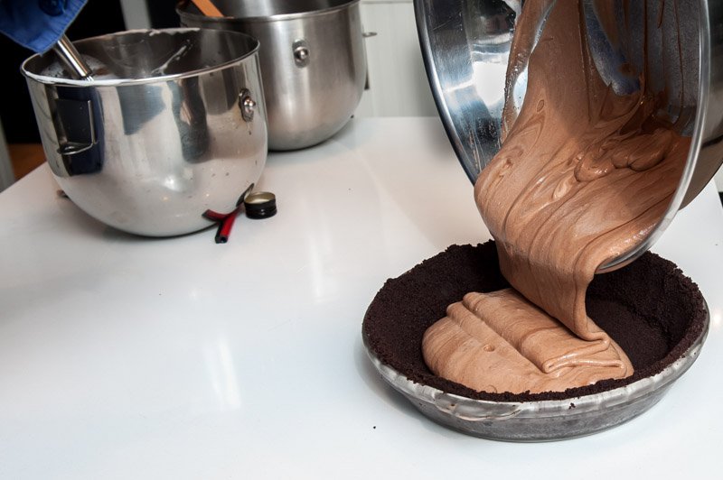 Pouring the cream into the chocolate crust.