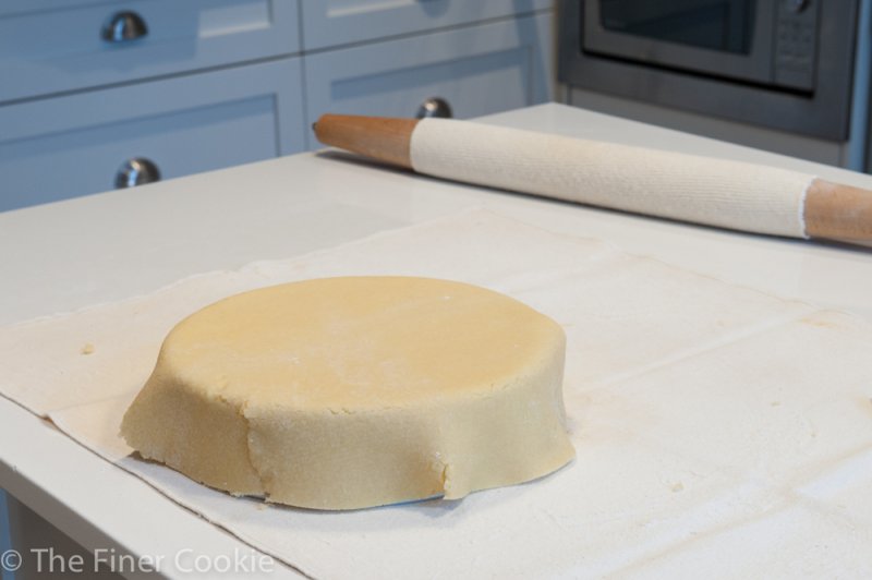 Pastry laying over the 8″ cake pan.
