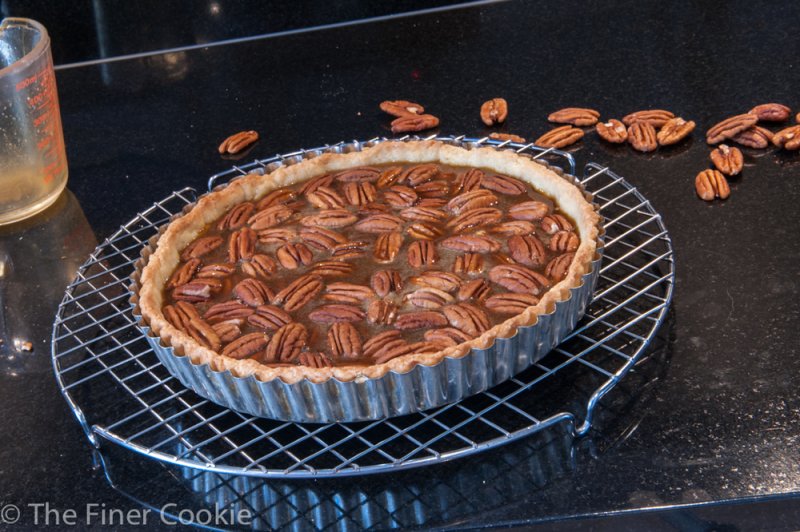 I strained it into a glass measuring cup and poured it over the pecans. Into the oven.