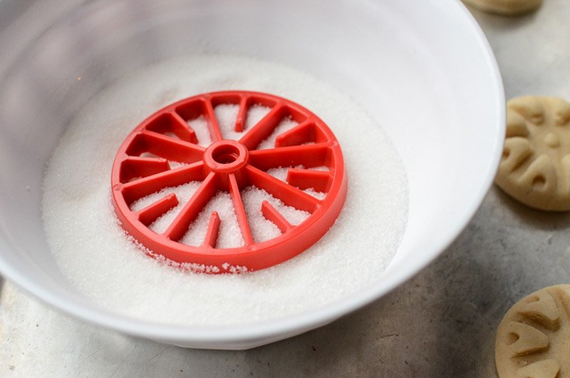 Dip this mold into sugar before pressing into the cookie.
