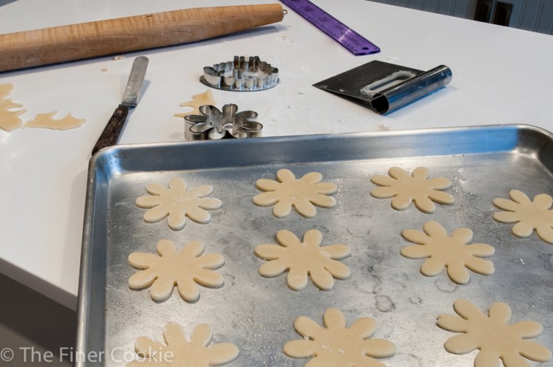 Cut cookies on the baking tray.