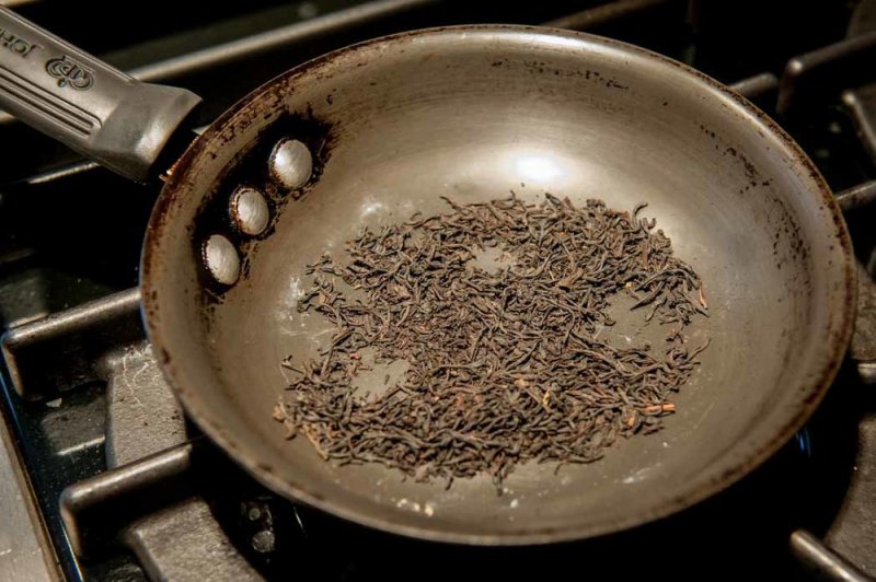 Toasting the Ice Wine Tea leaves.