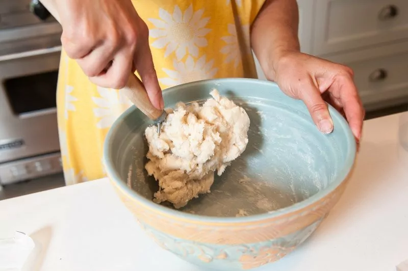 Mixing churro batter.