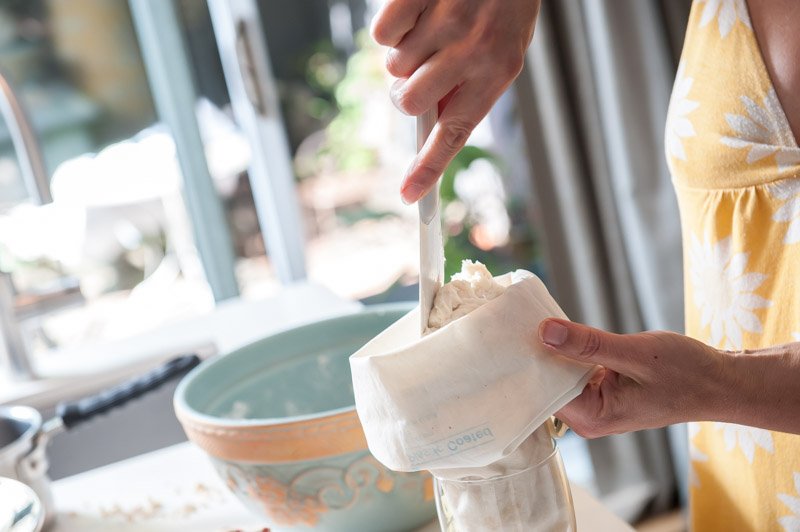 Filling the piping bag with churro batter