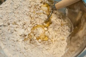 Adding the egg to the butter and rye flour.
