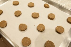 The cut cookie slices on their baking sheet.