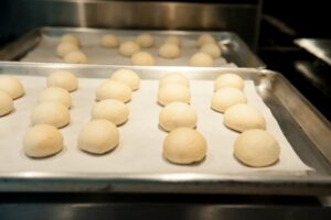 This tray of cookies are perfectly round and smooth. The finished cookies benefit from nicely shaped cookies.