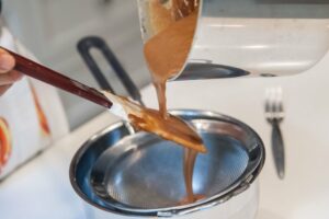 Straining the Dulce de Leche.