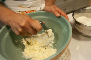 Cutting the butter and sugar.