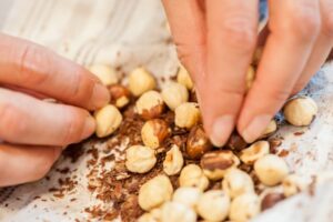 Rub the stubborn hazelnut skins off with your fingers