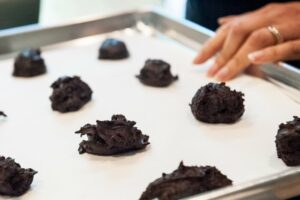 Preparing the tray of cookies.