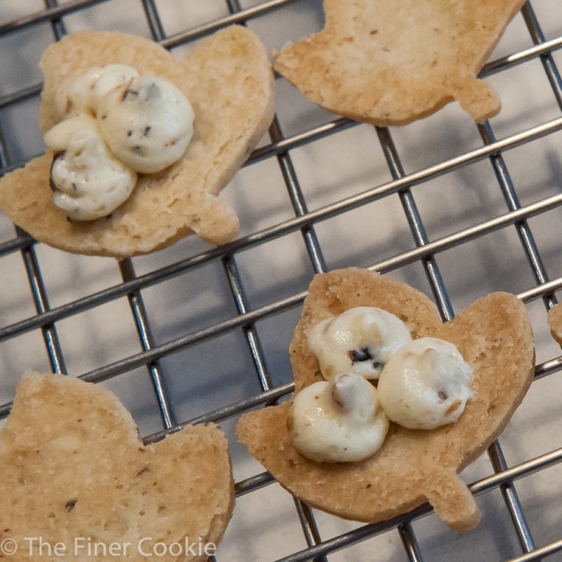 Filling the cookies with a pastry bag.