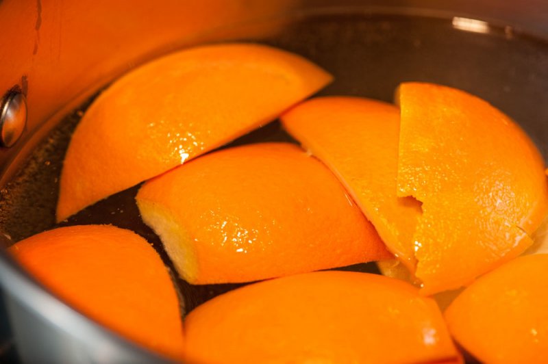 Blanching the orange rinds.