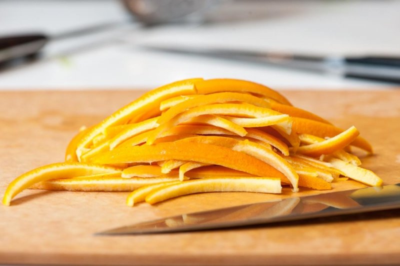 Blanched, trimmed and sliced orange peel.