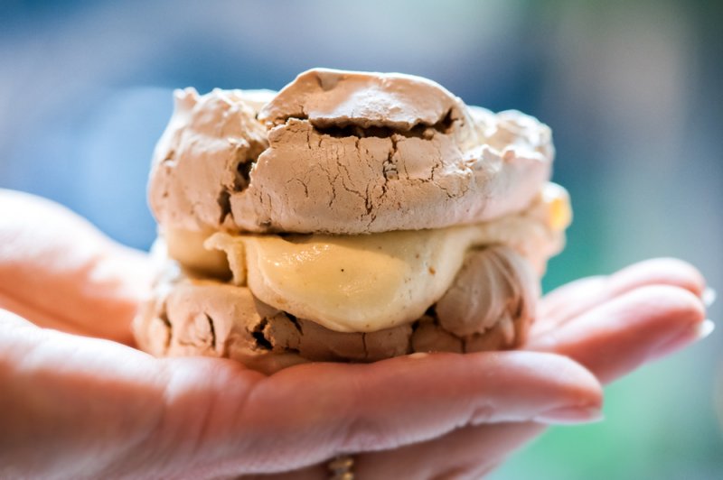 Praline Pecan Meringue Ice Cream Sandwiches in hand, The Finer Cookie.