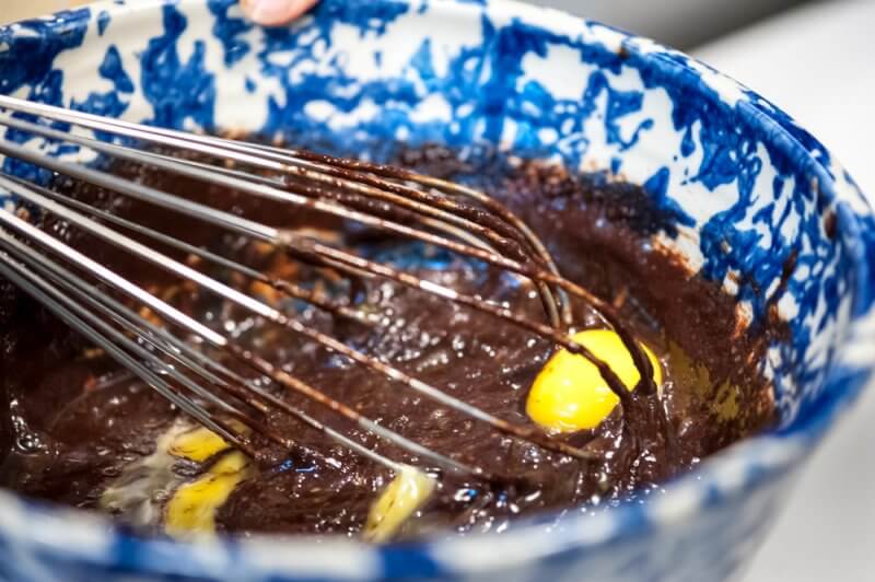 Add the egg to the brownie batter.