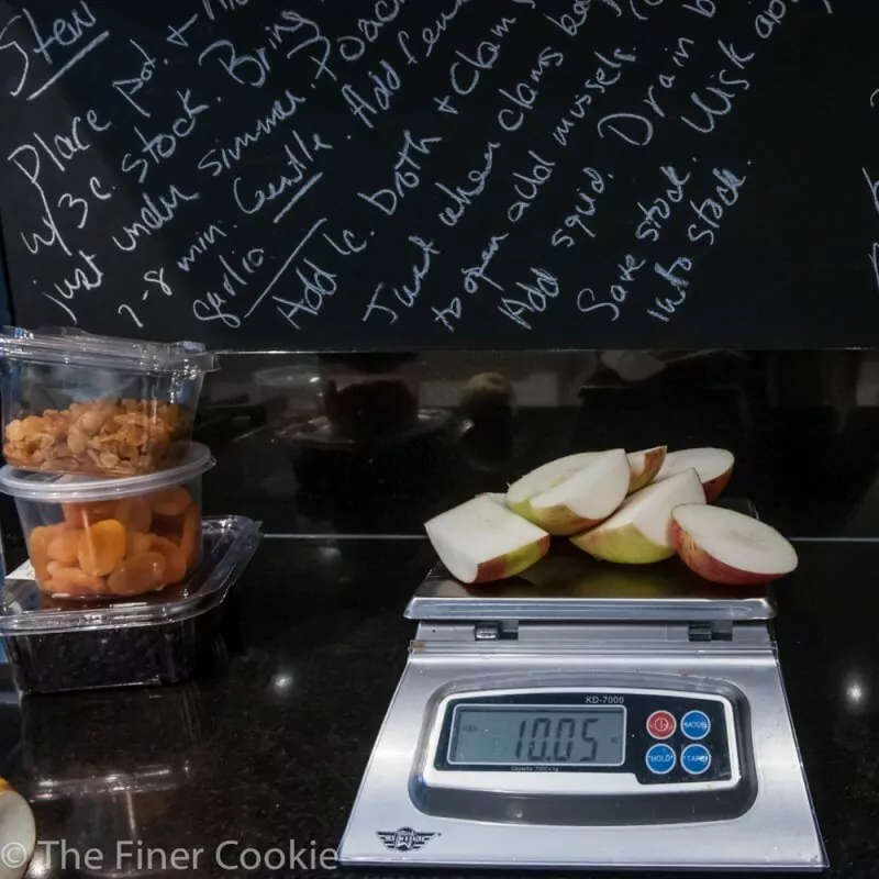 Weighing apples.