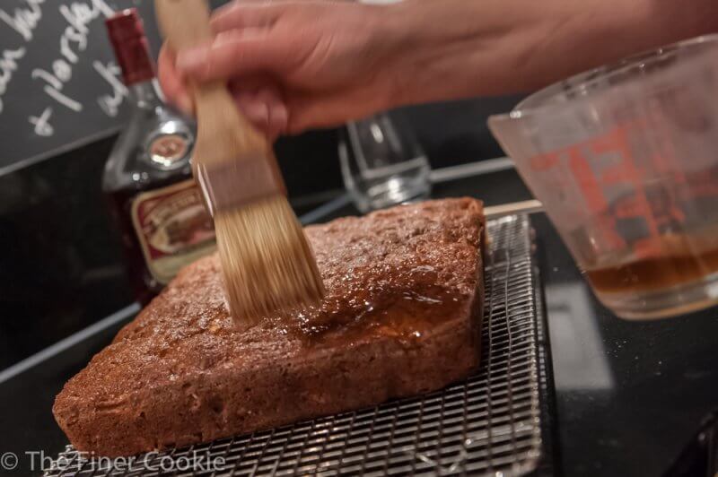 Brush the baked cake with syrup.