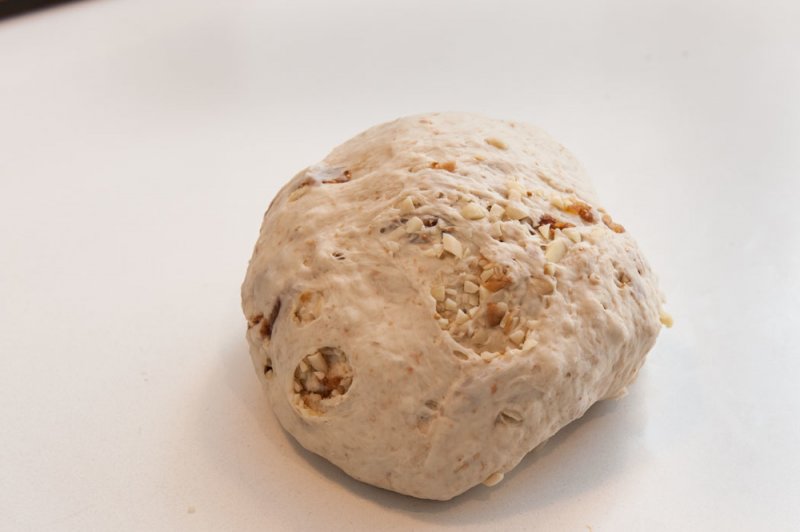 Bread dough kneaded with chopped almonds and figs.