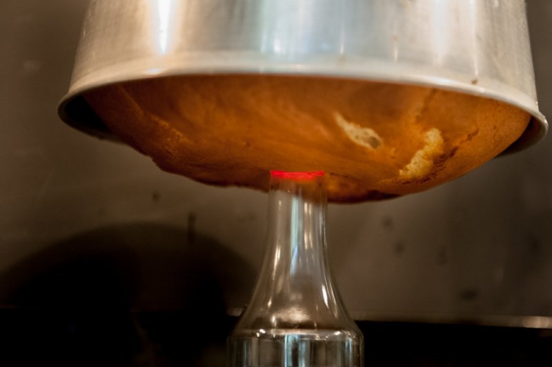 Hanging the cake upside down. Gravity is an essential ingredient for a Chiffon Cake.