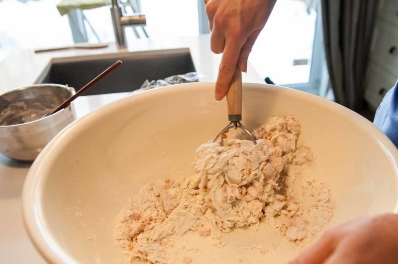 Mixing the dough with the dough whisk.