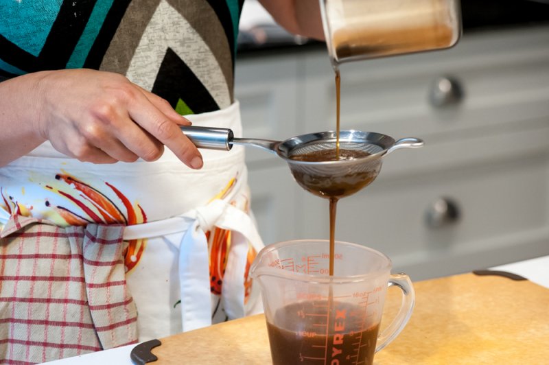 Straining the sugar filling.