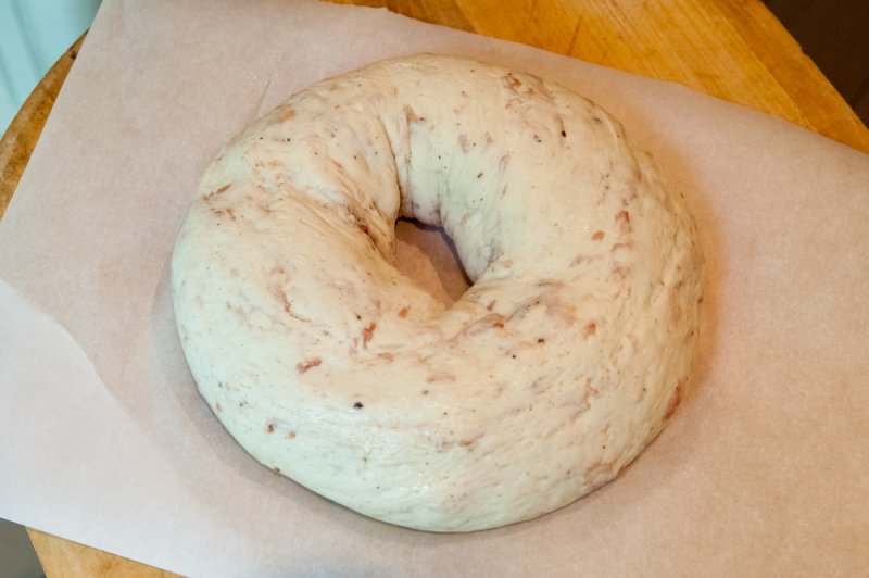 The dough on the peel ready for the oven.