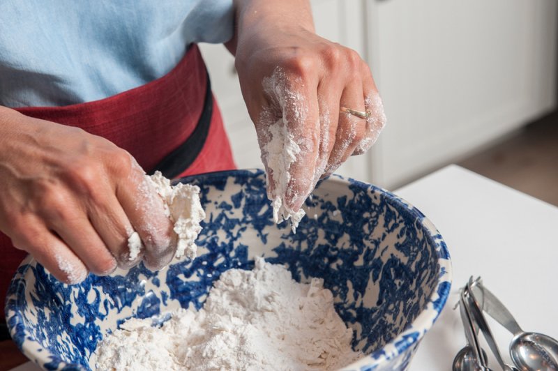 Working the cream cheese into the flour.