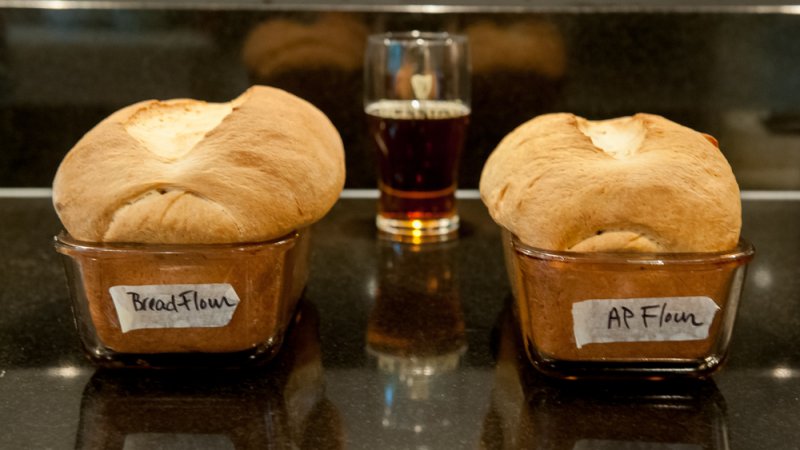 After baking the loaf made with bread flour is larger and heavier.