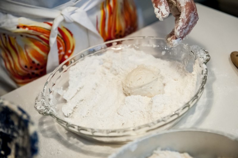 A scoop of batter into the flour.