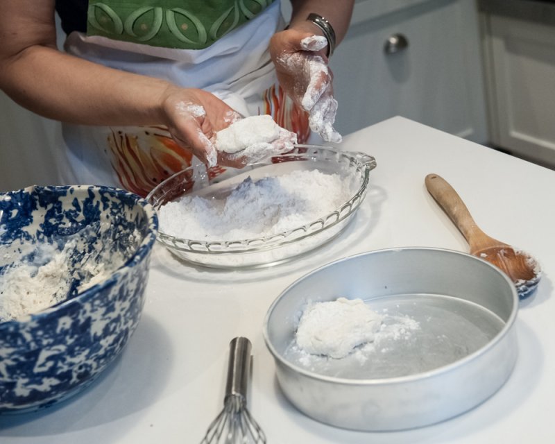 Dredging the batter into flour.