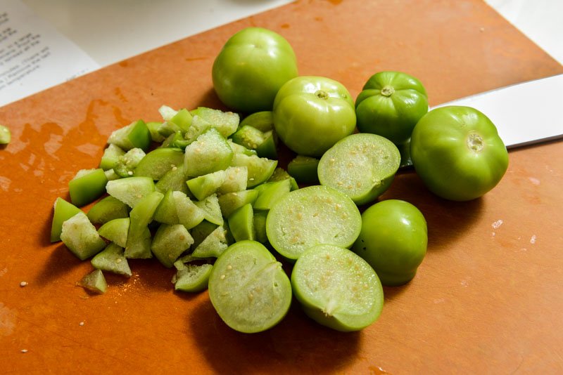 Chop the fresh tomatillos for the tartlets.