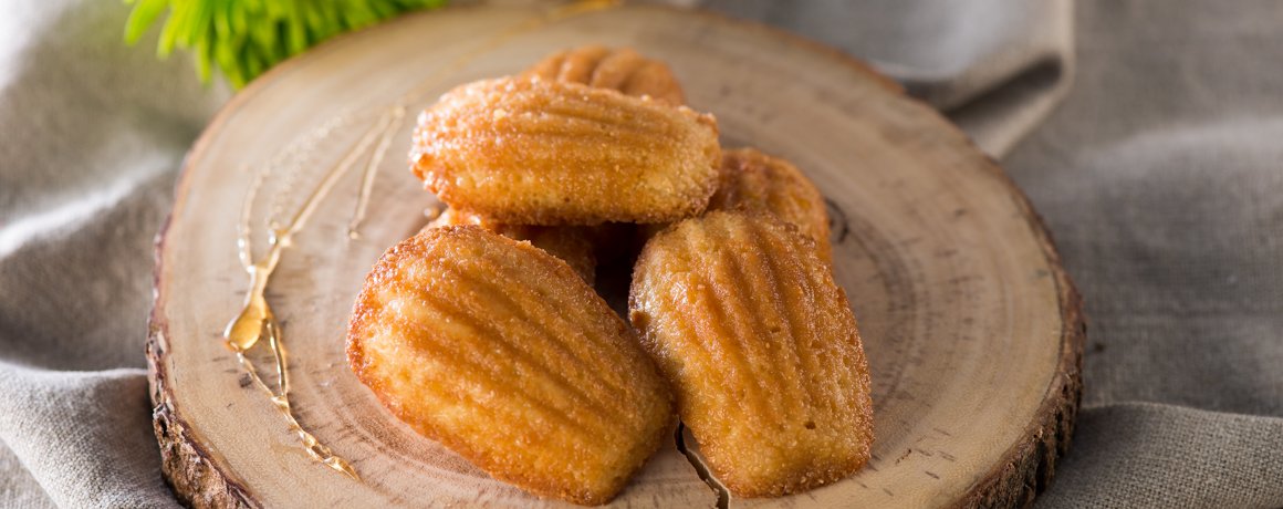 Maple Madeleines placed on wooden log cutting board