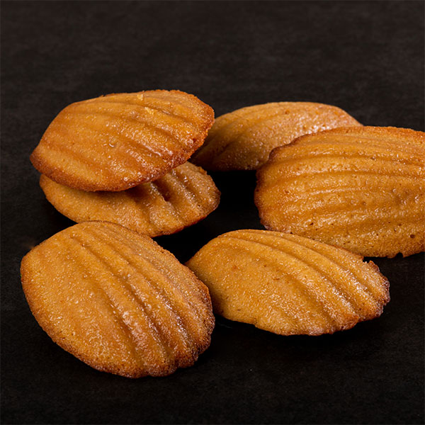 Maple Madeleines stacked on a table
